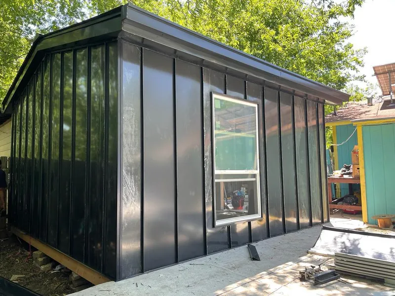 Black standing seam metal wall panels for Roof Inspection in Wilson